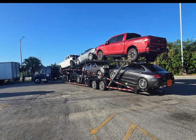 Multi-vehicle open carrier — loaded for a southbound run.