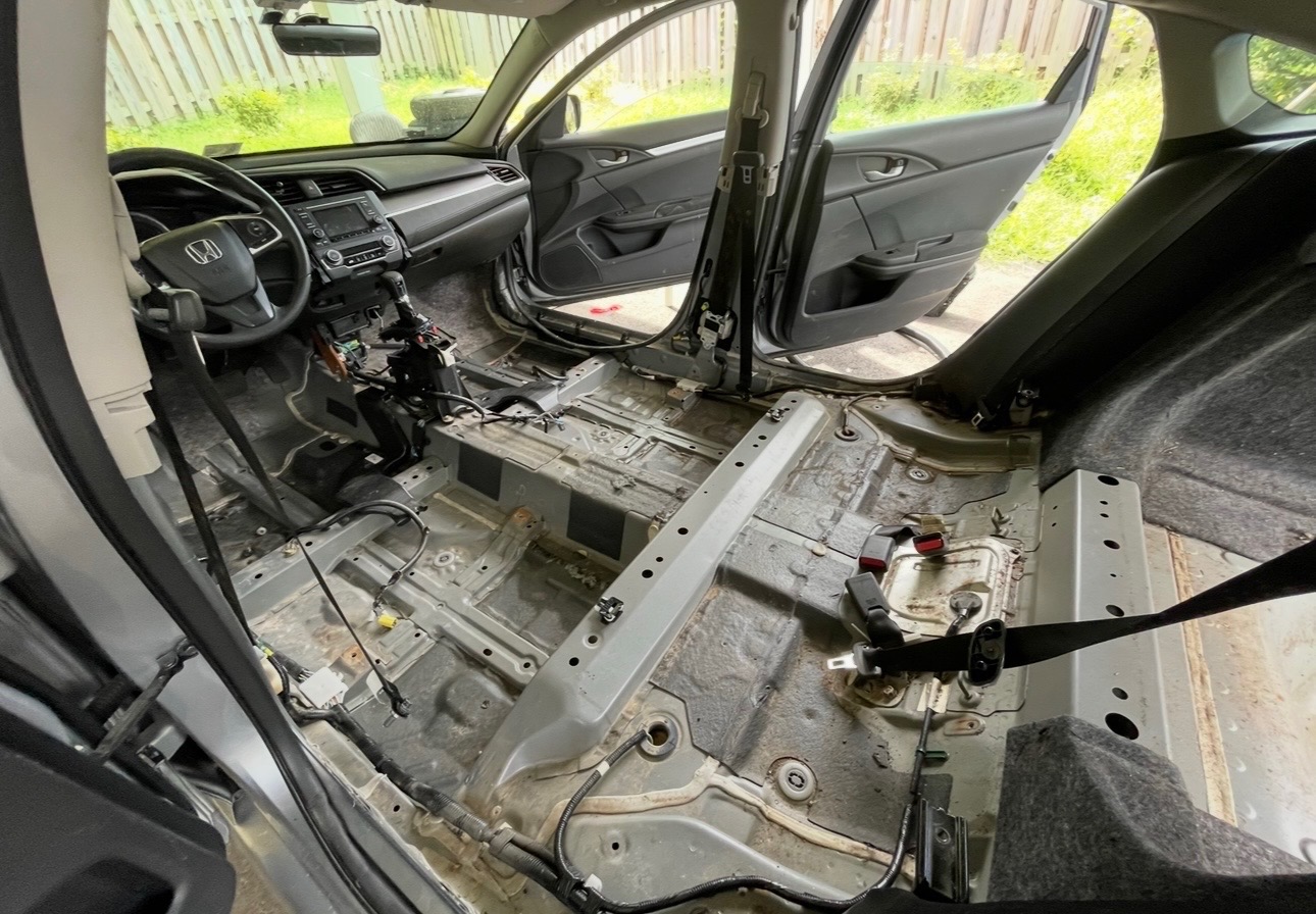 Seating removed and preparing for sound deadening.